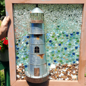 Lighthouse in a framed vintage window, colored glass