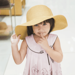 cute litte girl wearing a big hat, pay it forward movement