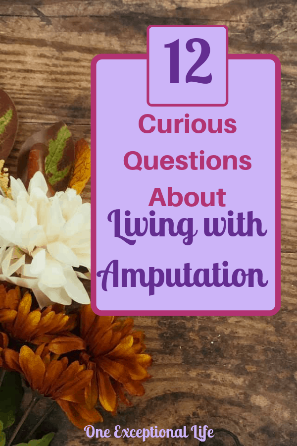 Wooden background with fall flowers, living with amputation