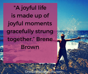 woman on rocks at ocean, joyful life brene brown quote